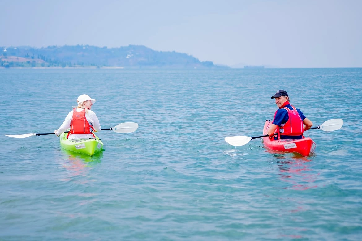 Guests canoeing on Lake Kivu during a 4-day mountain gorilla trekking tour in Rwanda.