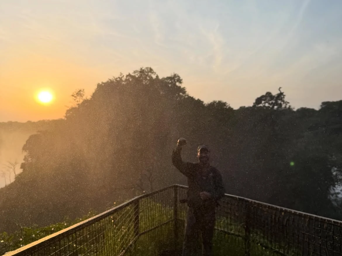 Guest enjoying panoramic views of Murchison Falls from the top of the falls in Uganda