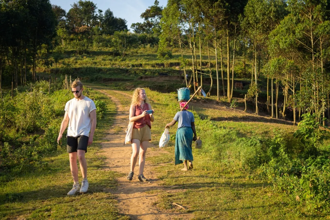 Tourists exploring lake Bunyonyi: cultural experiences, hiking, fishing experience, history, local food and island exploration, canoeing, and kayaking