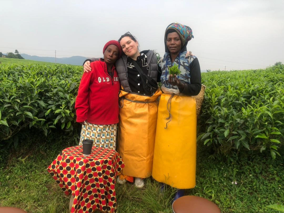 Traveler enjoying a tea plantation experience and tea tasting along Rwanda’s scenic Congo Nile Trail.